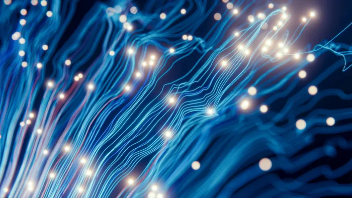 Cables de fibra óptica iluminados, representando la infraestructura de telecomunicaciones